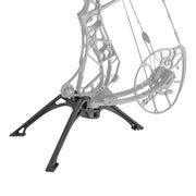 Black Mathews Engage ARC bow stand limbs legs supporting a silver compound bow with cams and string.